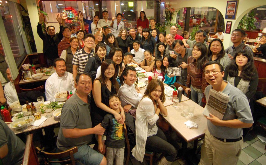 Group photo of AAJA photographers and family at the restaurant Pho Pasteur in Chinatown on Thursday night of the convention. (Photo by Barry Allen)