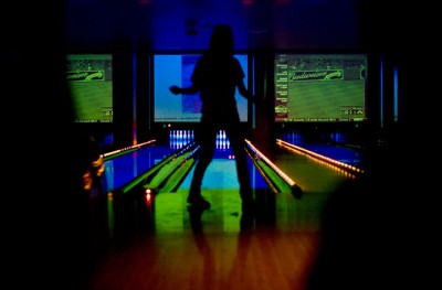 Michelle Le bowls Thursday night at a bowling bar in Hollywood Lucky Strike. Although the bar has many bowling lanes, most of the customers stay around the bar leaving the lanes empty. "Colorful Bowling" Fifth place: Kimihiro Hoshino, San Francisco State University